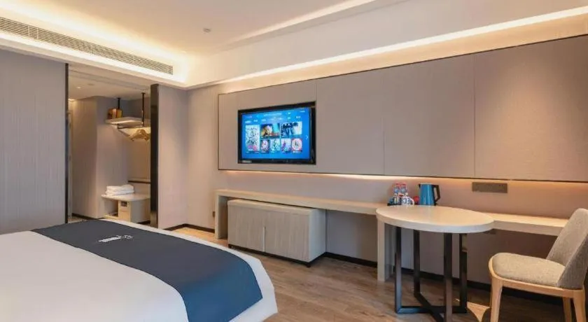 Bed in Echarm Hotel Suzhou Shengze Oriental Extile City