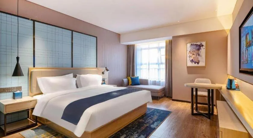 Bed in Echarm Hotel Suzhou Shengze Oriental Extile City