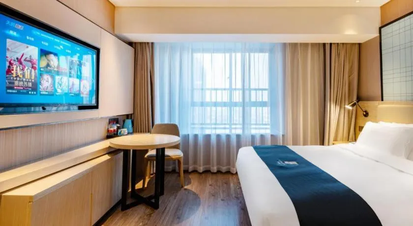 Bed in Echarm Hotel Suzhou Shengze Oriental Extile City