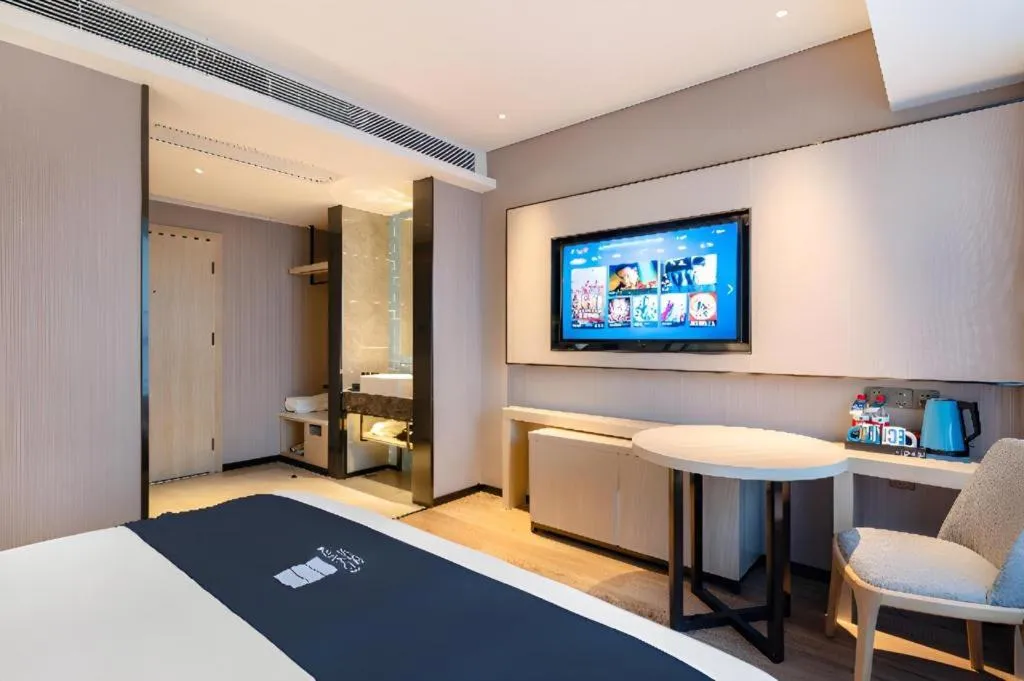 Bed in Echarm Hotel Suzhou Shengze Oriental Extile City