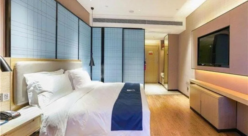 Bed in Echarm Hotel Suzhou Shengze Oriental Extile City