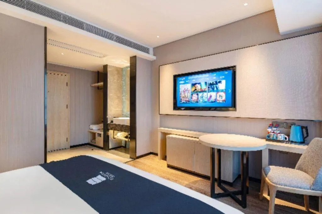 Bed in Echarm Hotel Suzhou Shengze Oriental Extile City