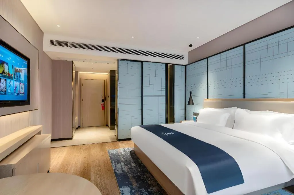 Bed in Echarm Hotel Suzhou Shengze Oriental Extile City