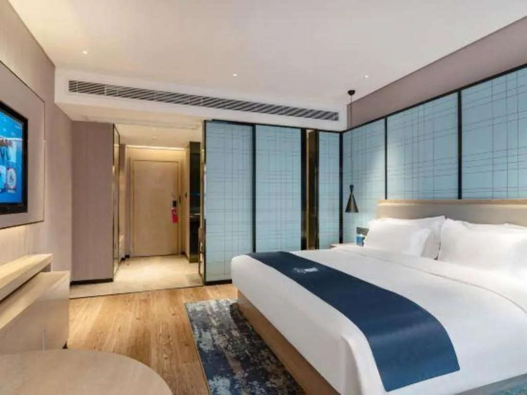 Bed in Echarm Hotel Suzhou Shengze Oriental Extile City