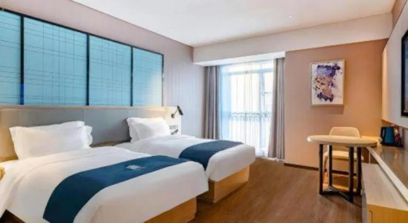 Bed in Echarm Hotel Suzhou Shengze Oriental Extile City