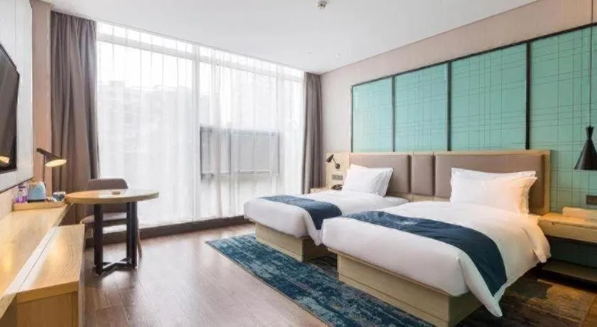 Bed in Echarm Hotel Suzhou Shengze Oriental Extile City