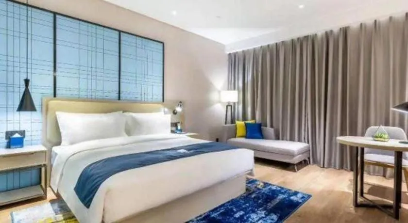 Bed in Echarm Hotel Suzhou Shengze Oriental Extile City