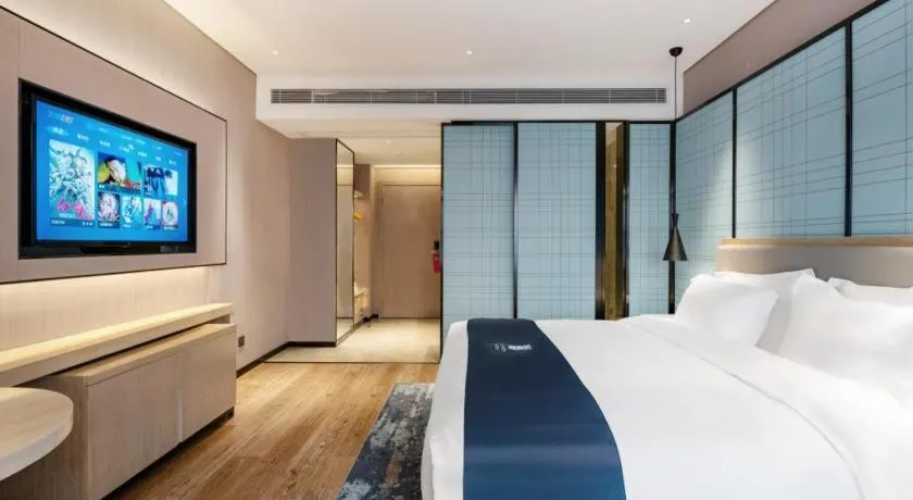 Bed in Echarm Hotel Suzhou Shengze Oriental Extile City