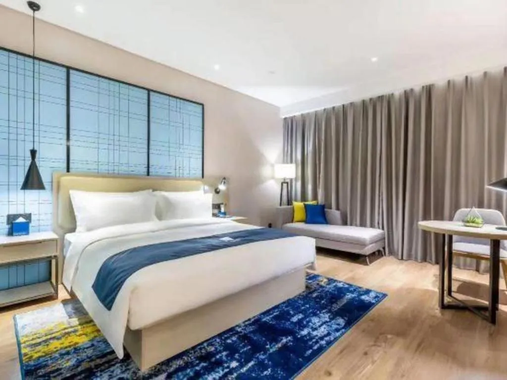 Bed in Echarm Hotel Suzhou Shengze Oriental Extile City