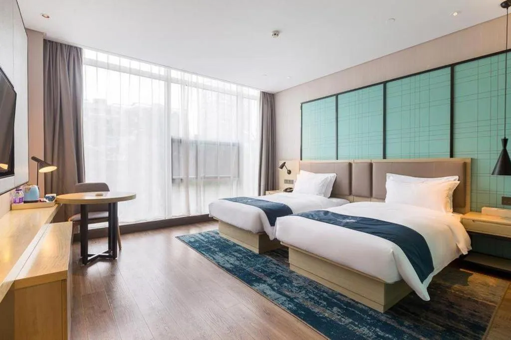 Bed in Echarm Hotel Suzhou Shengze Oriental Extile City