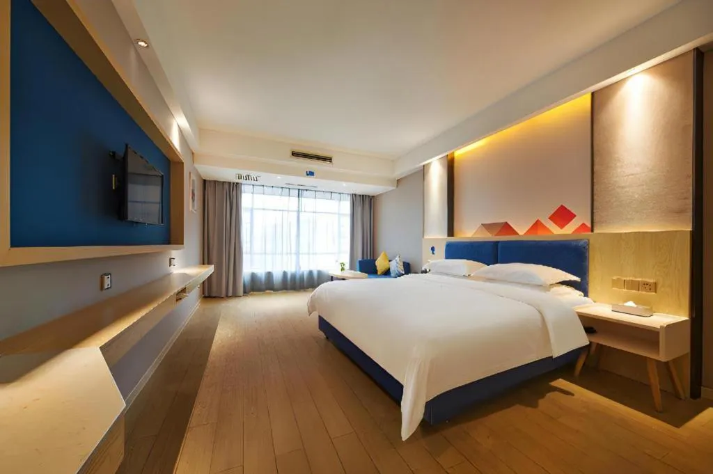 Bed in Borrman Hotel Liuzhou High-Speed Railway Station