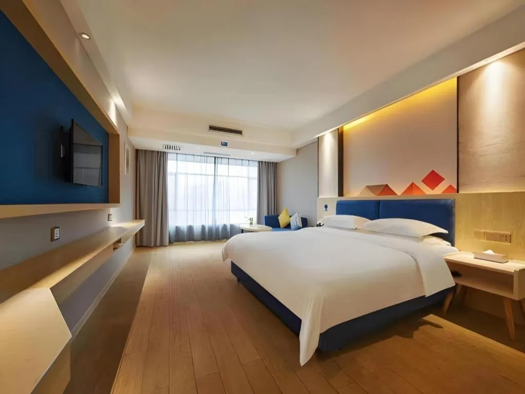 Bed in Borrman Hotel Liuzhou High-Speed Railway Station