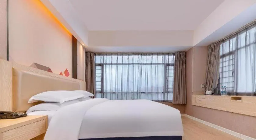 Bed in Borrman Hotel Liuzhou High-Speed Railway Station