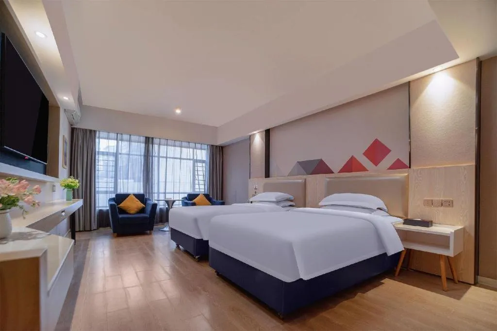 Bed in Borrman Hotel Liuzhou High-Speed Railway Station