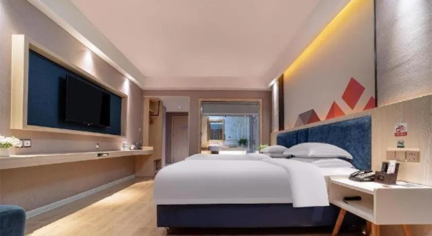 Bed in Borrman Hotel Liuzhou High-Speed Railway Station