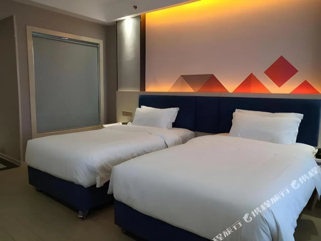 Bed in Borrman Hotel Liuzhou High-Speed Railway Station