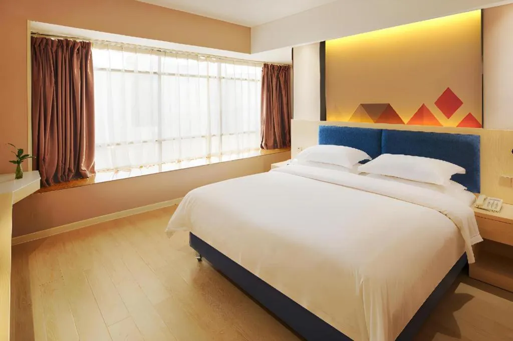 Bed in Borrman Hotel Liuzhou High-Speed Railway Station