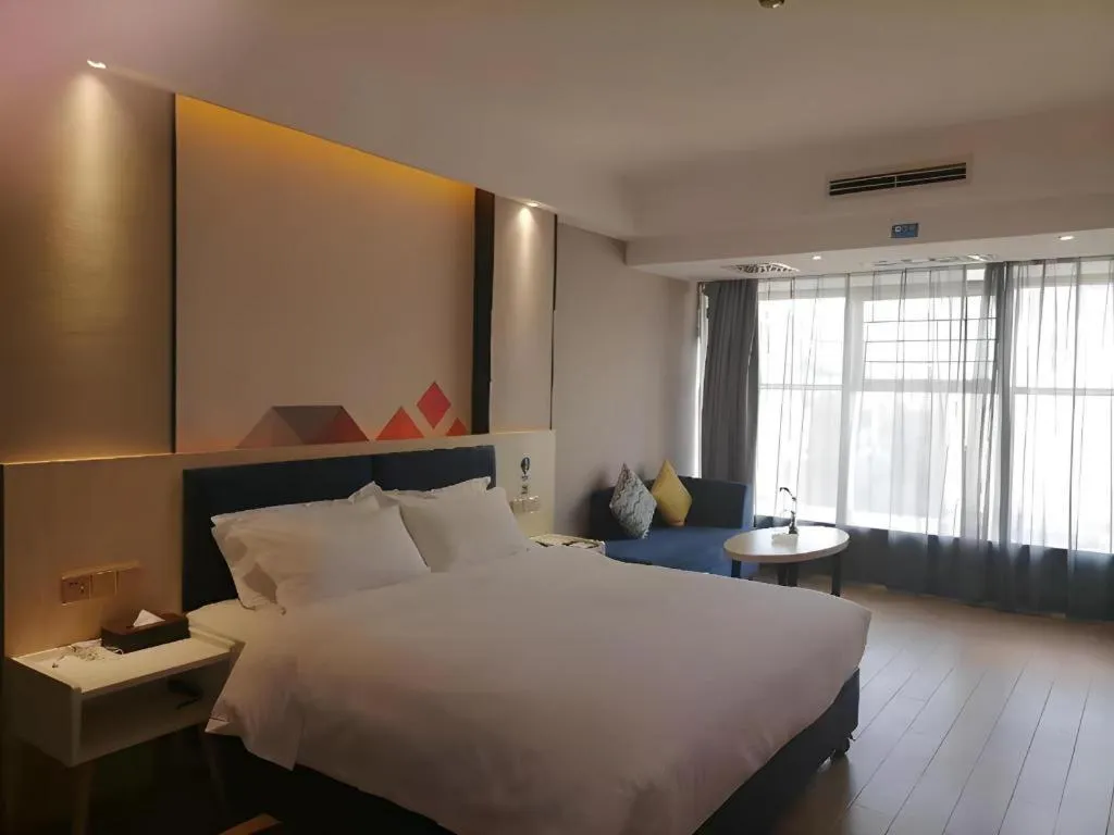 Bed in Borrman Hotel Liuzhou High-Speed Railway Station