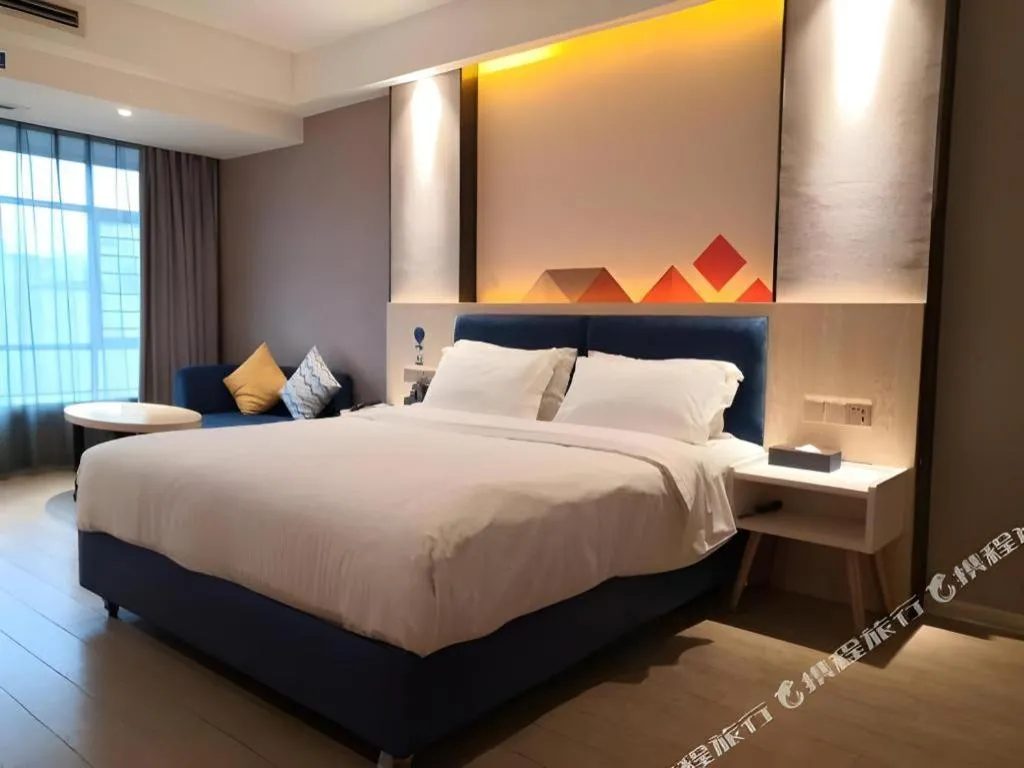Bed in Borrman Hotel Liuzhou High-Speed Railway Station