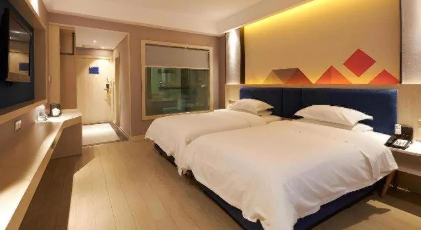 Bed in Borrman Hotel Liuzhou High-Speed Railway Station