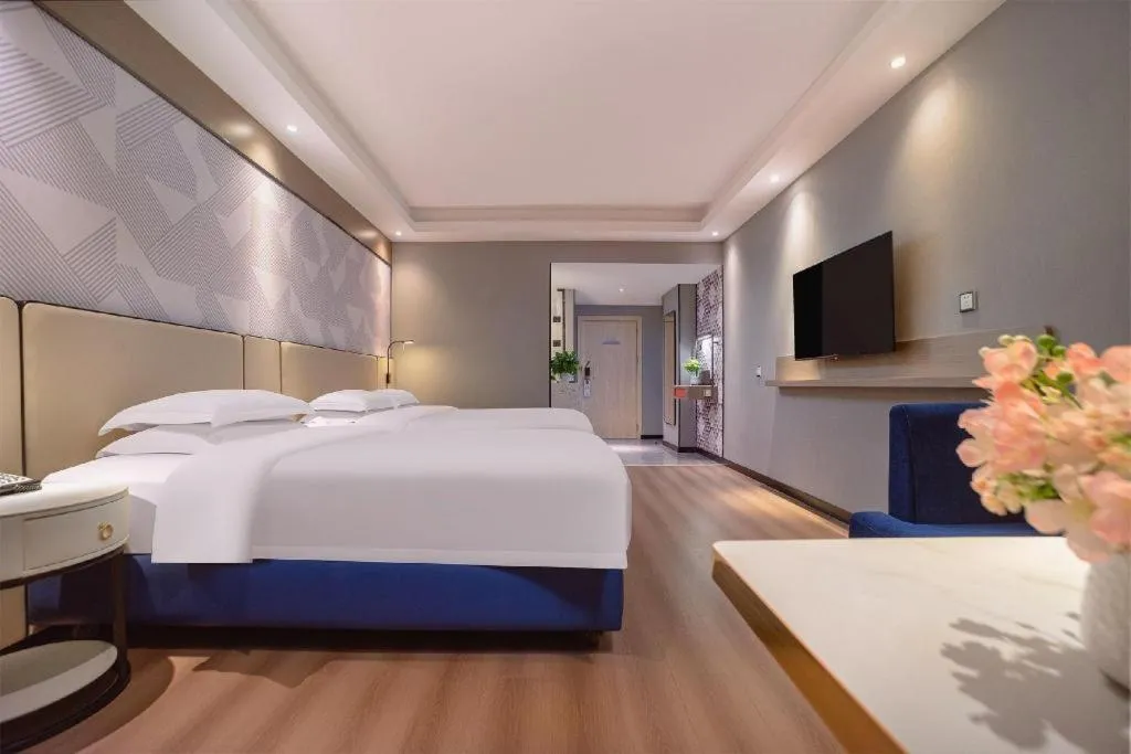 Bed in Borrman Hotel Liuzhou High-Speed Railway Station