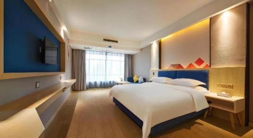 Bed in Borrman Hotel Liuzhou High-Speed Railway Station