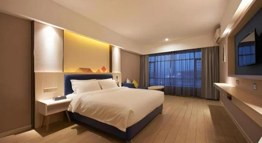 Bed in Borrman Hotel Liuzhou High-Speed Railway Station