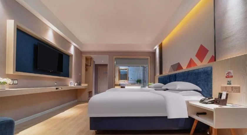 Bed in Borrman Hotel Liuzhou High-Speed Railway Station