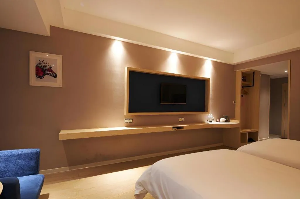 Bed in Borrman Hotel Liuzhou High-Speed Railway Station