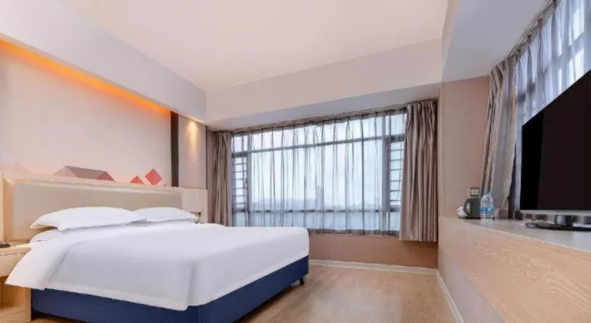 Bed in Borrman Hotel Liuzhou High-Speed Railway Station