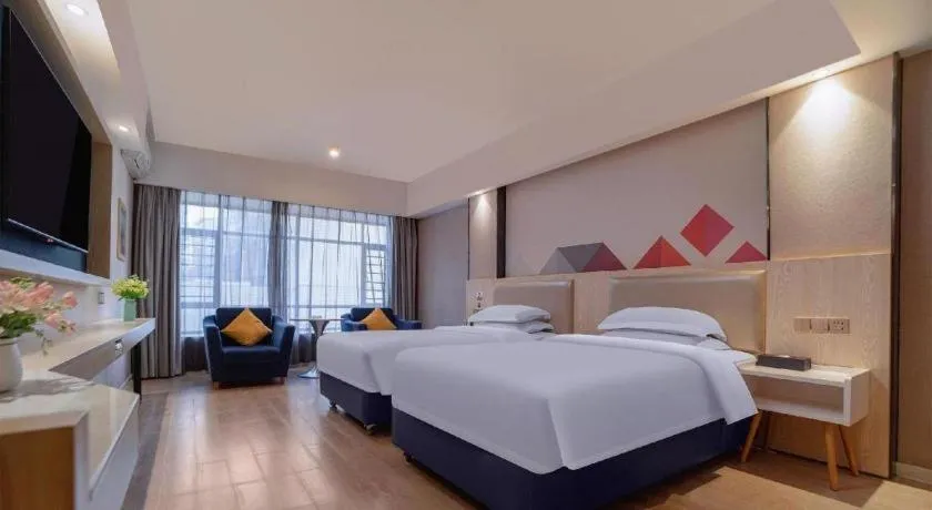 Bed in Borrman Hotel Liuzhou High-Speed Railway Station