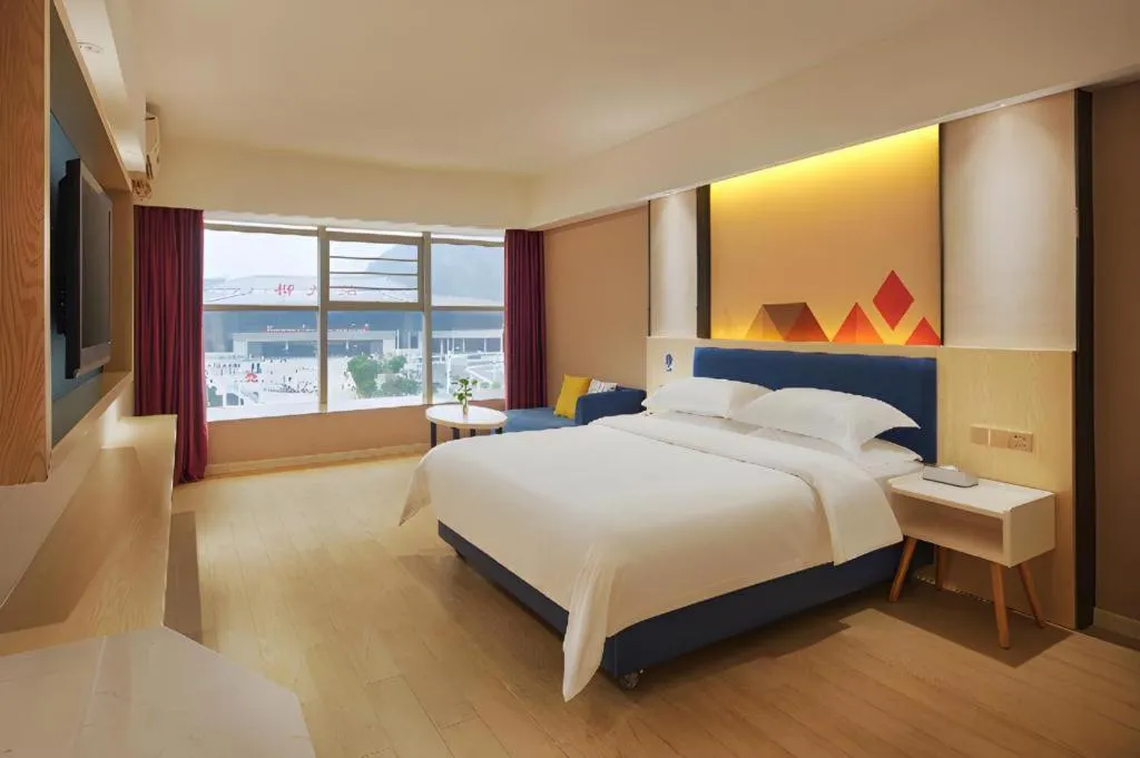 Bed in Borrman Hotel Liuzhou High-Speed Railway Station