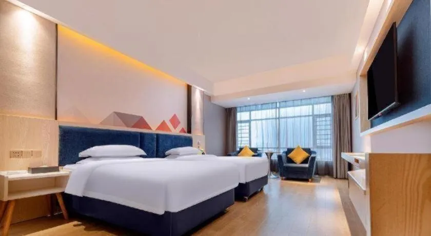 Bed in Borrman Hotel Liuzhou High-Speed Railway Station