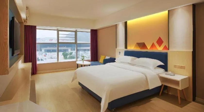 Bed in Borrman Hotel Liuzhou High-Speed Railway Station