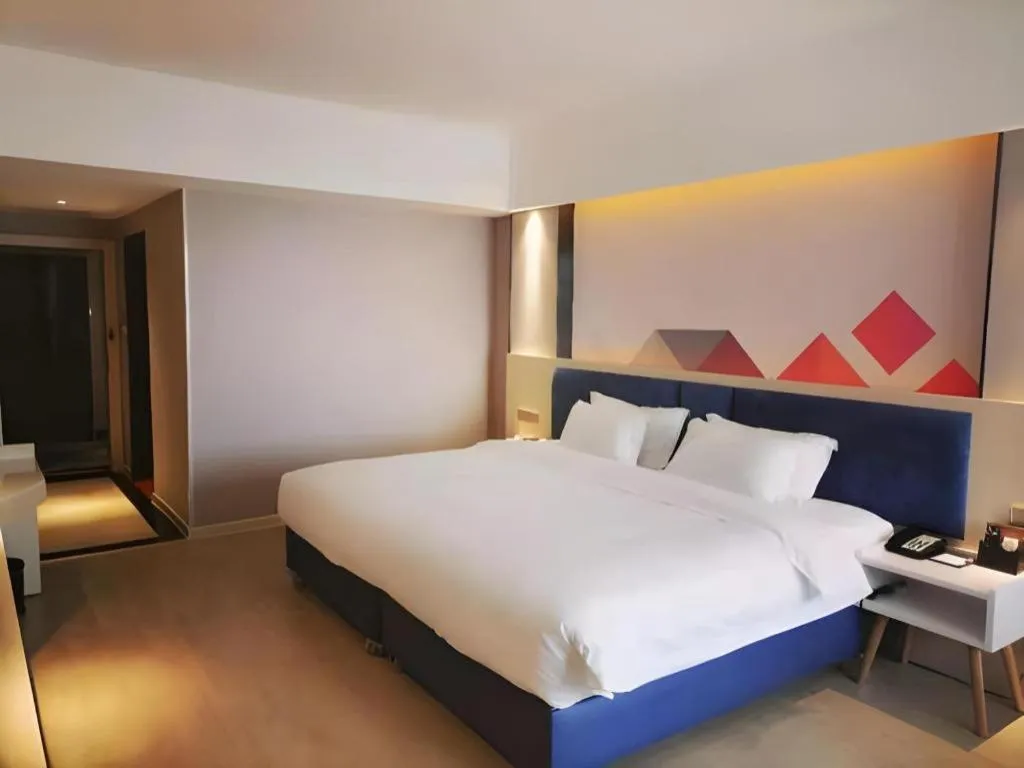 Bed in Borrman Hotel Liuzhou High-Speed Railway Station