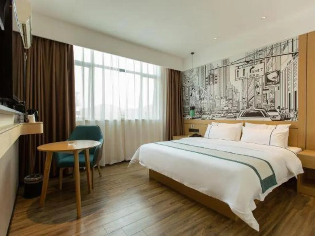 Bed in City Comfort Inn Shaoguan Biguiyuan Phoenix City Gold Village