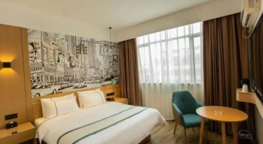 Bed in City Comfort Inn Shaoguan Biguiyuan Phoenix City Gold Village