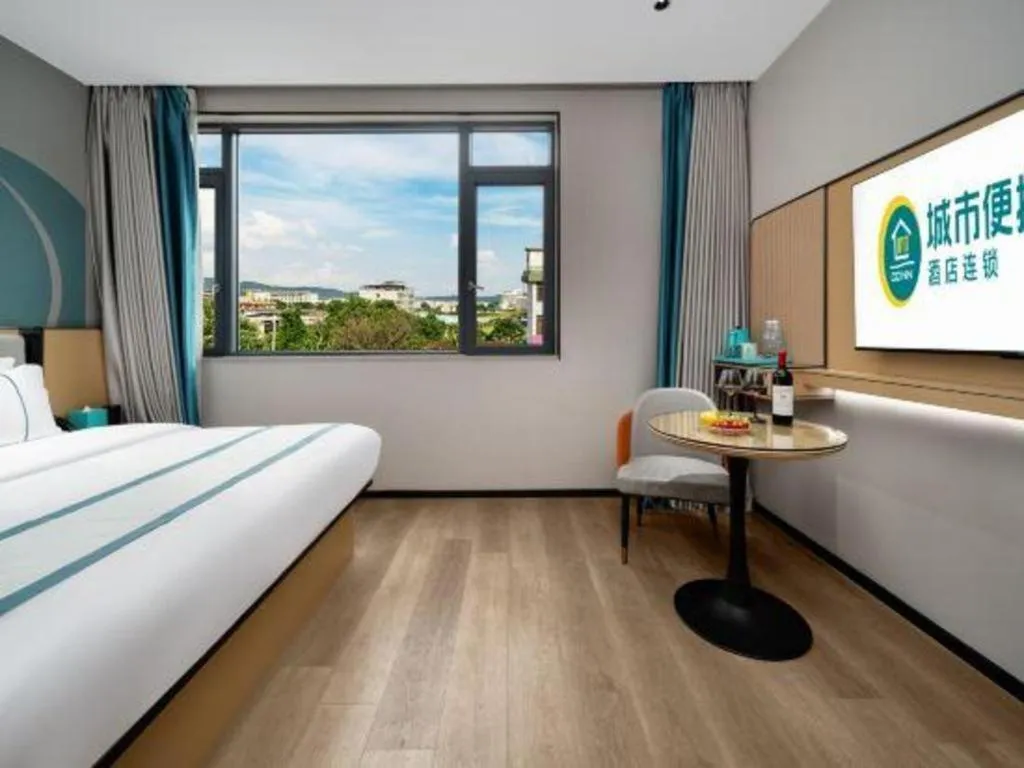 Bed in City Comfort Inn Shaoguan Biguiyuan Phoenix City Gold Village