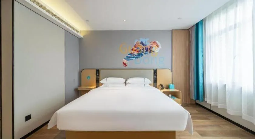 Bed in City Comfort Inn Shaoguan Biguiyuan Phoenix City Gold Village