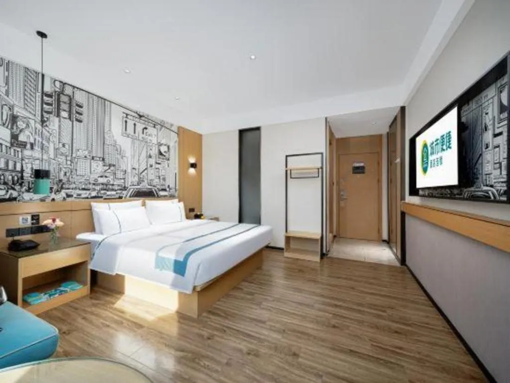 Bed in City Comfort Inn Shaoguan Biguiyuan Phoenix City Gold Village