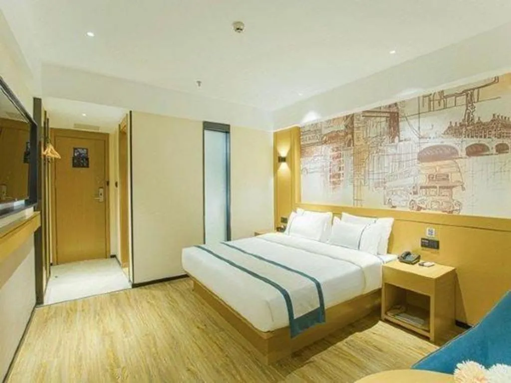 Bed in City Comfort Inn Wuzhou Sun Plaza Wanda