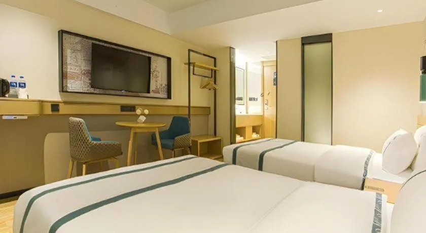 Bed in City Comfort Inn Wuzhou Sun Plaza Wanda