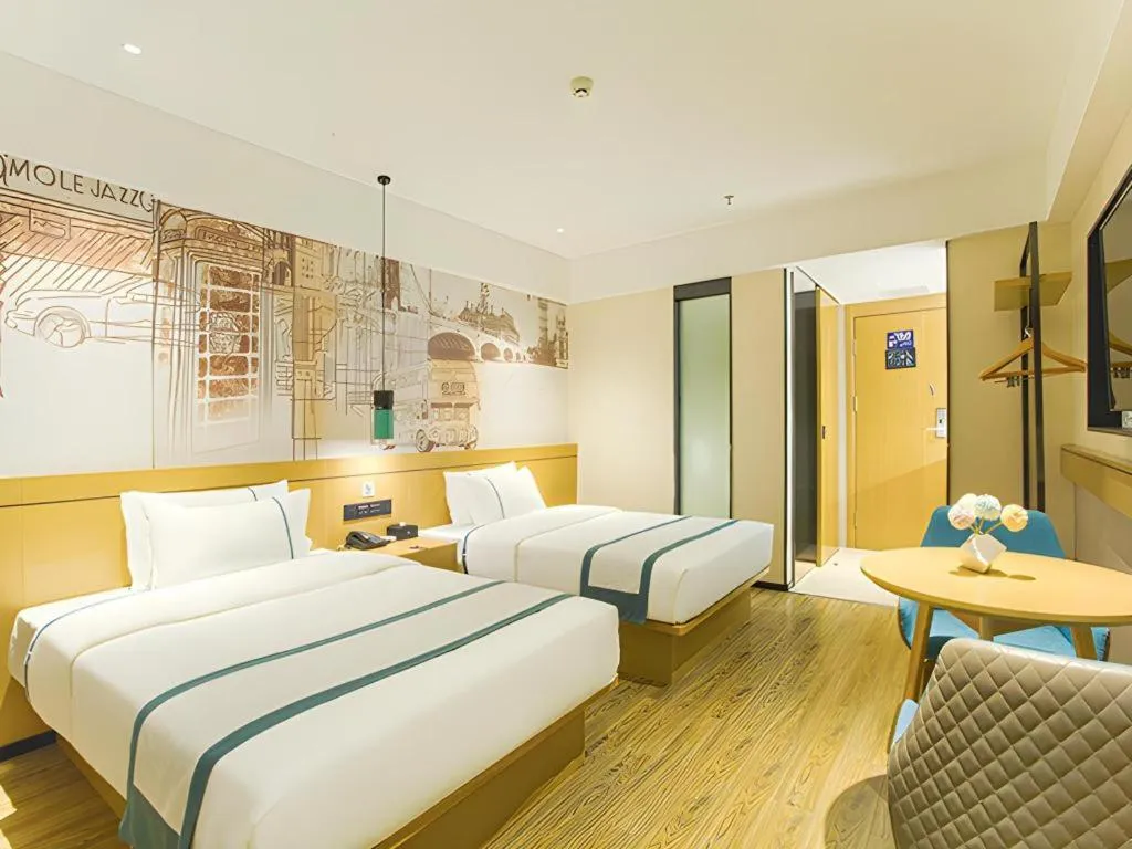 Bed in City Comfort Inn Wuzhou Sun Plaza Wanda