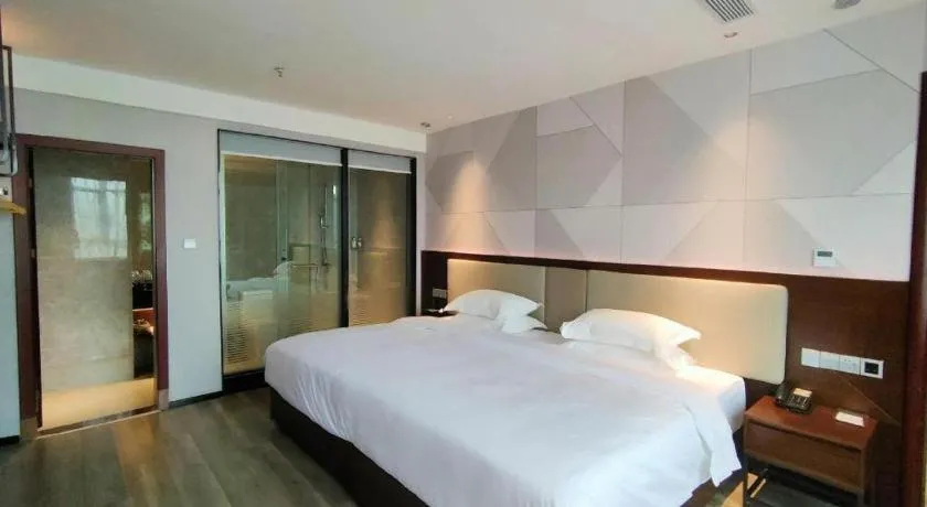 Bed in Borrman Hotel Yunfu Xinxing County Bus Station