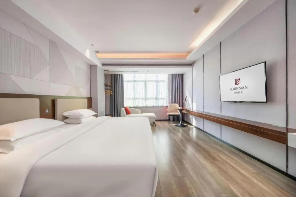 Bed in Borrman Hotel Yunfu Xinxing County Bus Station