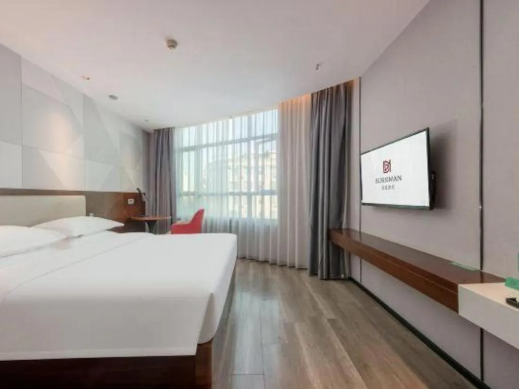 Bed in Borrman Hotel Yunfu Xinxing County Bus Station