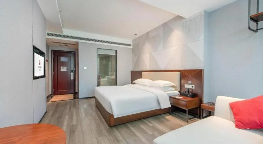 Bed in Borrman Hotel Yunfu Xinxing County Bus Station