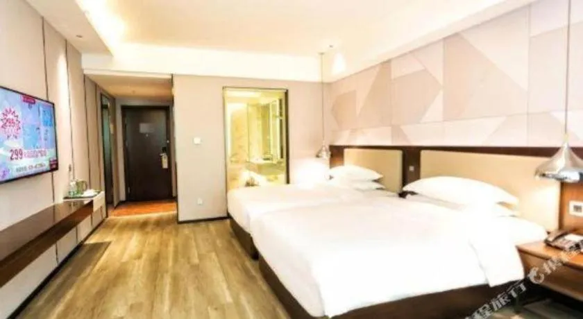 Bed in Borrman Hotel Yunfu Xinxing County Bus Station