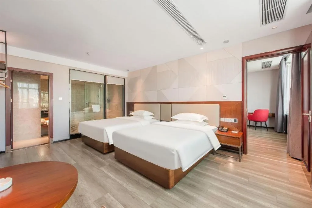 Bed in Borrman Hotel Yunfu Xinxing County Bus Station