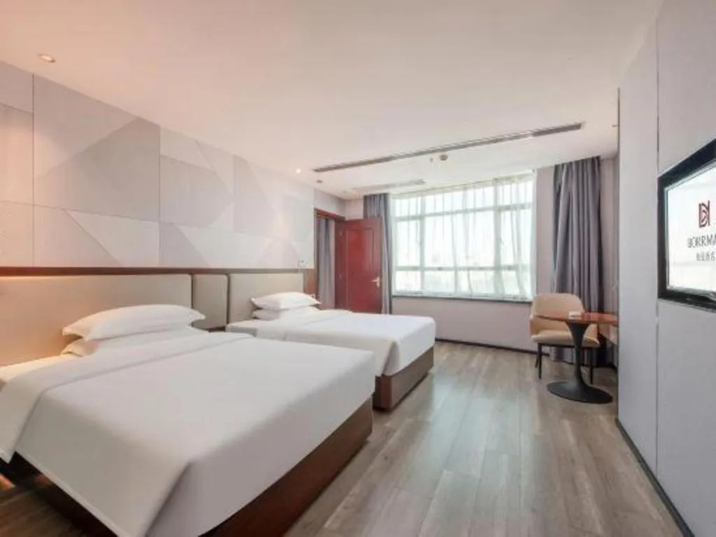 Bed in Borrman Hotel Yunfu Xinxing County Bus Station